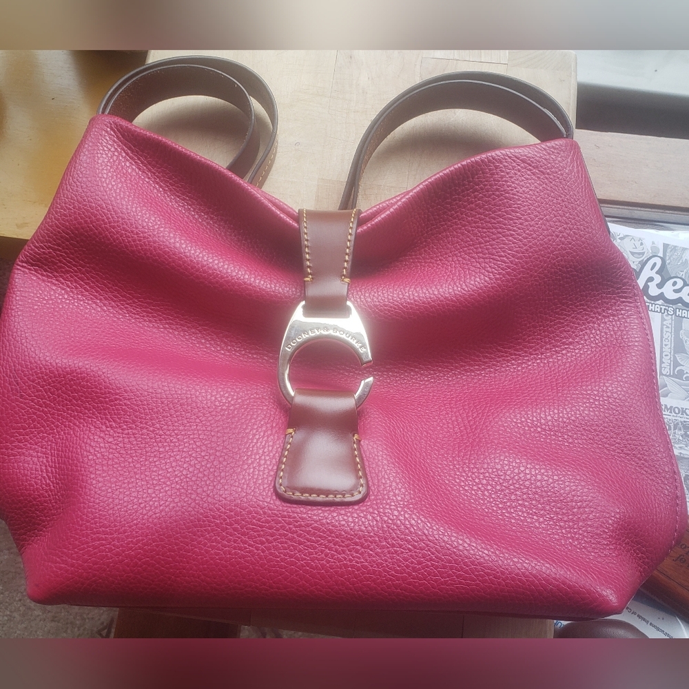 Dooney and Bourke Logo Lock Hobo Bag. Measures 14 " W 10 " L  5-6 D Strap 7".